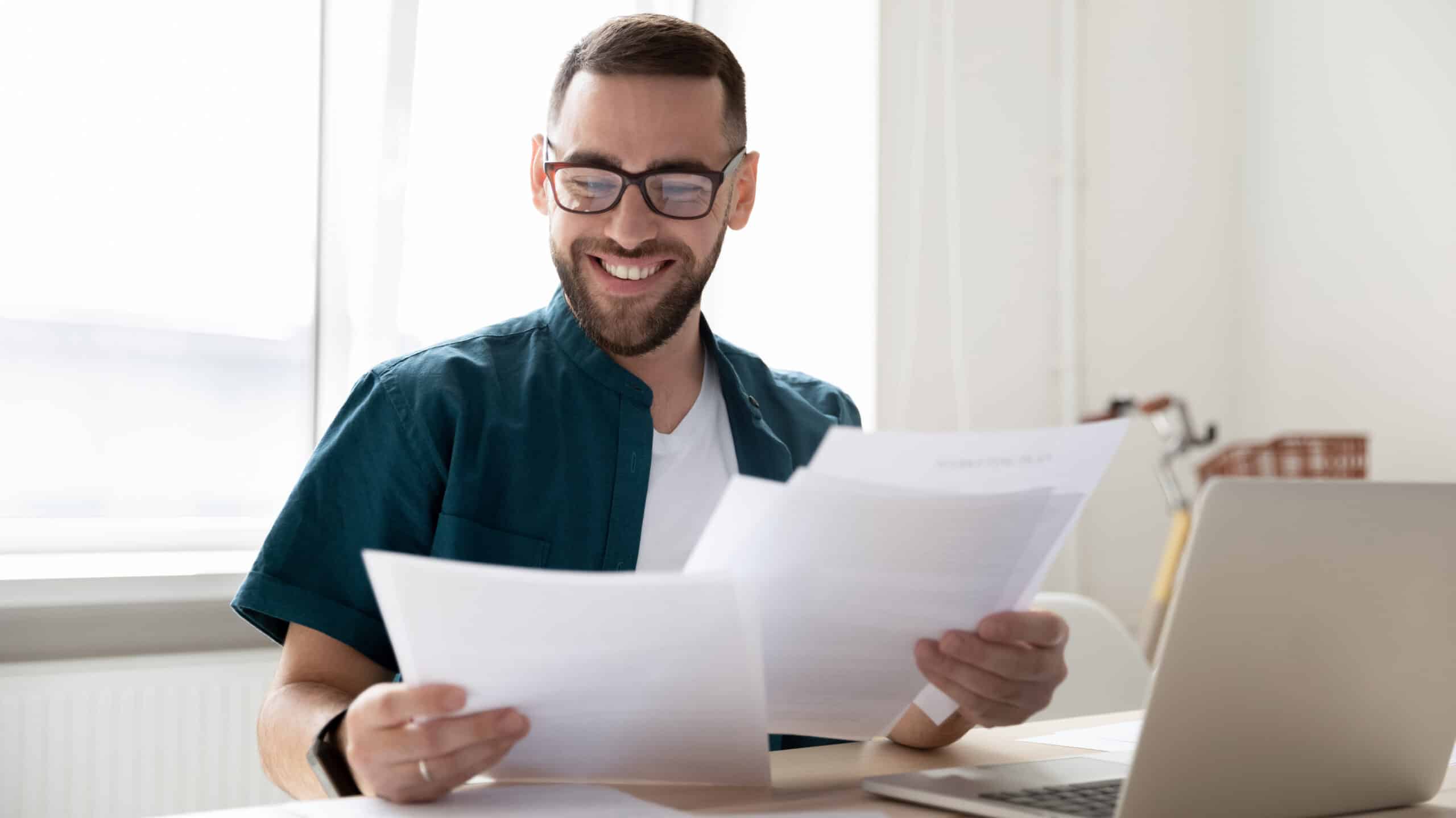 Happy man looking at credit references